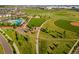 Aerial view of neighborhood with pool, playground, ball fields and walking trails at 10295 E 59Th Ave, Denver, CO 80238