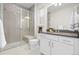 Bathroom with glass shower, modern vanity, and grey countertop at 10295 E 59Th Ave, Denver, CO 80238