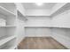 Spacious walk-in closet with ample shelving and rods for organization and storage solutions at 10295 E 59Th Ave, Denver, CO 80238