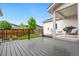 Back deck with space for entertaining and a view of the fenced in backyard at 10295 E 59Th Ave, Denver, CO 80238