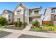 Stylish two-story home with stone accents, front yard landscaping, and a welcoming porch at 10295 E 59Th Ave, Denver, CO 80238