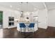 Modern kitchen featuring white cabinets, stainless steel appliances, and a center island at 10295 E 59Th Ave, Denver, CO 80238