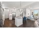 Bright, modern kitchen with stainless appliances, a center island, and open layout at 10295 E 59Th Ave, Denver, CO 80238