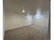 Spacious finished basement with neutral carpet, white trim, and recessed lighting at 2521 Billings St, Aurora, CO 80011