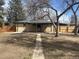 Beautiful brick home featuring mature trees in a well-kept lawn at 2521 Billings St, Aurora, CO 80011