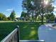 Serene park view with lush green grass, mature trees, covered picnic area, and winding pathway at 2521 Billings St, Aurora, CO 80011