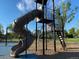 Playground featuring a tall slide, climbing structure, and cushioned ground cover at 2521 Billings St, Aurora, CO 80011