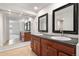 Elegant bathroom featuring a double sink vanity with dark wood cabinetry at 12671 E Bates Cir, Aurora, CO 80014
