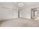 Spacious bedroom with neutral carpet, vaulted ceiling, and ample closet space at 12671 E Bates Cir, Aurora, CO 80014