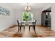Bright dining room with hardwood floors and a modern chandelier at 12671 E Bates Cir, Aurora, CO 80014