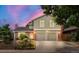 Charming two-story home with a two-car garage and lush landscaping in a suburban neighborhood at 12671 E Bates Cir, Aurora, CO 80014