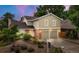 Charming two-story home with a two-car garage and lush landscaping in a suburban neighborhood at 12671 E Bates Cir, Aurora, CO 80014