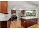 Spacious kitchen with stainless steel appliances, hardwood floors, and a large island at 12671 E Bates Cir, Aurora, CO 80014
