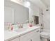 Clean bathroom with white vanity and marble tile at 715 S Alton Way # 5A, Denver, CO 80247