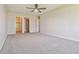 Large bedroom with ceiling fan and grey carpeting at 715 S Alton Way # 5A, Denver, CO 80247
