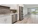 Modern kitchen features stainless steel appliances and white shaker cabinets at 715 S Alton Way # 5A, Denver, CO 80247