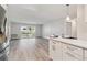 Modern kitchen with white cabinets and stainless steel appliances at 715 S Alton Way # 5A, Denver, CO 80247