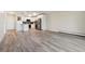 Open living area with wood-look floors and view to kitchen at 715 S Alton Way # 5A, Denver, CO 80247
