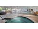 Indoor pool and hot tub with surrounding benches at 715 S Alton Way # 5A, Denver, CO 80247