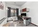 Bright home office with natural light, built-in desk, storage, and ergonomic chair at 7395 Heiter Hill Dr, Evergreen, CO 80439