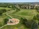 Overhead view of the park with playgrounds, soccer fields, and walking paths, perfect for outdoor activities at 8953 W Brandt Pl, Littleton, CO 80123