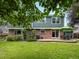 A lush backyard featuring a brick patio perfect for outdoor dining at 8953 W Brandt Pl, Littleton, CO 80123