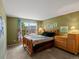 Comfortable bedroom with natural light, wooden furniture, and charming decor at 8953 W Brandt Pl, Littleton, CO 80123