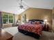 Spacious main bedroom with a plush carpet, a ceiling fan, and large windows offering ample natural light at 8953 W Brandt Pl, Littleton, CO 80123