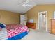 Bright bedroom features neutral carpeting, vaulted ceiling, and two closets for optimal storage at 8953 W Brandt Pl, Littleton, CO 80123