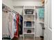 Walk-in closet with custom shelving and ample storage space for clothes, shoes, and accessories at 8953 W Brandt Pl, Littleton, CO 80123