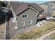 A high-angle shot showcasing the back of a modern two-story house with a deck at 3008 Mountain Sky Dr, Castle Rock, CO 80104