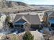 An aerial view of a single-Gathering home featuring a covered porch and attached garage at 3008 Mountain Sky Dr, Castle Rock, CO 80104