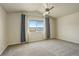 Spacious bedroom with large window and ceiling fan at 3008 Mountain Sky Dr, Castle Rock, CO 80104