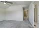 Bedroom with grey carpet and access to hallway at 3008 Mountain Sky Dr, Castle Rock, CO 80104