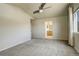 Bright bedroom with ceiling fan and access to bathroom at 3008 Mountain Sky Dr, Castle Rock, CO 80104