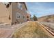 Side view of house showing siding exterior, landscaping, and a pathway at 3008 Mountain Sky Dr, Castle Rock, CO 80104