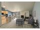 Open concept living room with fireplace and adjacent kitchen at 3008 Mountain Sky Dr, Castle Rock, CO 80104