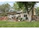The backyard has a patio and a small gazebo and a partially built stone feature at 6514 Zinnia St, Arvada, CO 80004
