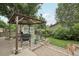 Backyard featuring a gazebo, lush grass, and mature trees at 6514 Zinnia St, Arvada, CO 80004