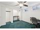 Finished basement with green carpet, natural light, and storage at 6514 Zinnia St, Arvada, CO 80004