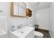 Updated bathroom featuring a modern vanity, new fixtures, and a clean, contemporary design at 6514 Zinnia St, Arvada, CO 80004