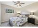 Bright bedroom with a ceiling fan and a large window providing plenty of natural light at 6514 Zinnia St, Arvada, CO 80004