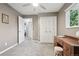 Bedroom featuring a ceiling fan and an adjacent closet at 6514 Zinnia St, Arvada, CO 80004