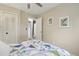 Cozy bedroom with a ceiling fan and a large closet providing plenty of storage space at 6514 Zinnia St, Arvada, CO 80004