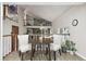 Cozy dining area with hardwood floors and bright natural light, creating a warm and inviting atmosphere at 6514 Zinnia St, Arvada, CO 80004