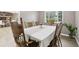 Formal dining room with traditional wood furniture, wood floors, and natural light at 6514 Zinnia St, Arvada, CO 80004