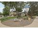 A landscaped corner lot featuring a charming two-story home with well-maintained lawn and garden at 6514 Zinnia St, Arvada, CO 80004