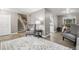 Open-concept living room with staircase and connections to other living areas at 6514 Zinnia St, Arvada, CO 80004