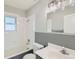 Bathroom featuring bathtub and shower combo, grey backsplash, and matching vanity at 101 S 11 Ave, Brighton, CO 80601