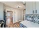 Stylish kitchen featuring modern backsplash, stainless steel appliances, and new wooden flooring at 101 S 11 Ave, Brighton, CO 80601